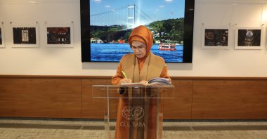 First lady Emine Erdoğan signs the guest book at Gül Baba Tomb in Budapest, Hungary, Nov. 7, 2024. (AA Photo)