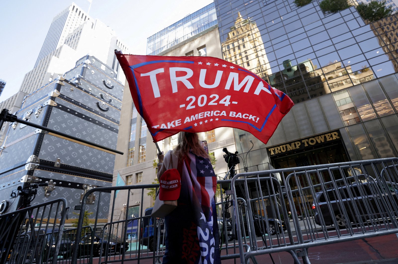 A person waves a Trump flag outside Trump Tower in New York City, U.S., Nov. 6, 2024. (Reuters Photo)