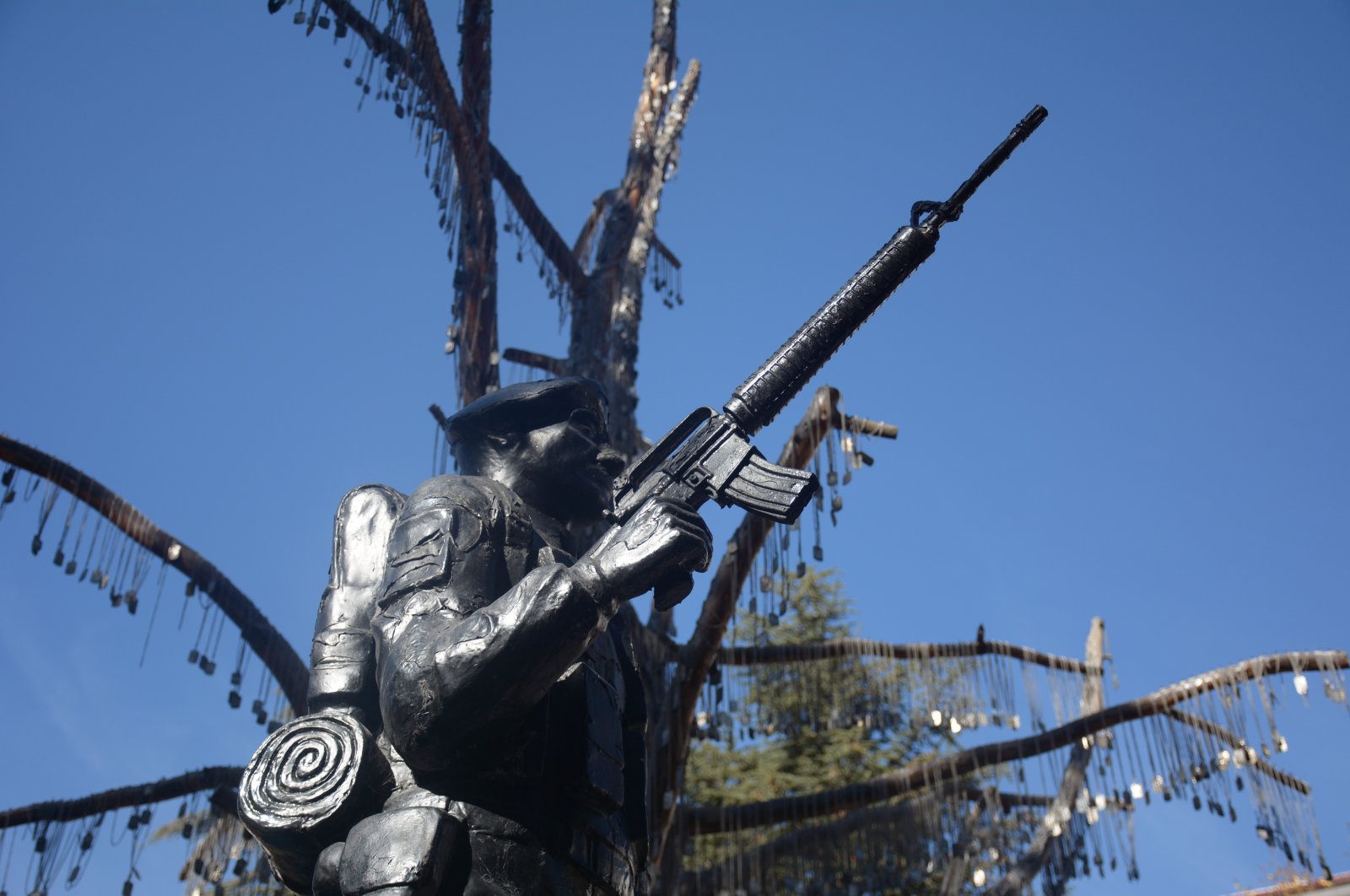 Dog tags with the names of 5 martyrs who died in the TAI attack are hung on Martyrs Memorial Tree in Kızılcahamam, Ankara, Türkiye, Nov. 1, 2024. (IHA Photo)