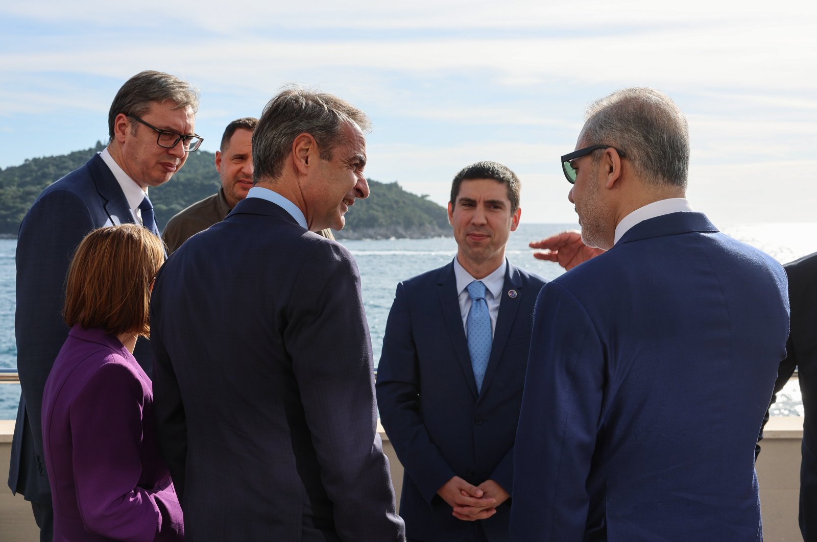 Foreign Minister Hakan Fidan (R) chats with Greek Prime Minister Kyriakos Mitsotakis (2nd R) on the sidelines of an event, Dubrovnik, Croatia, Oct. 9, 2024. (AA Photo)