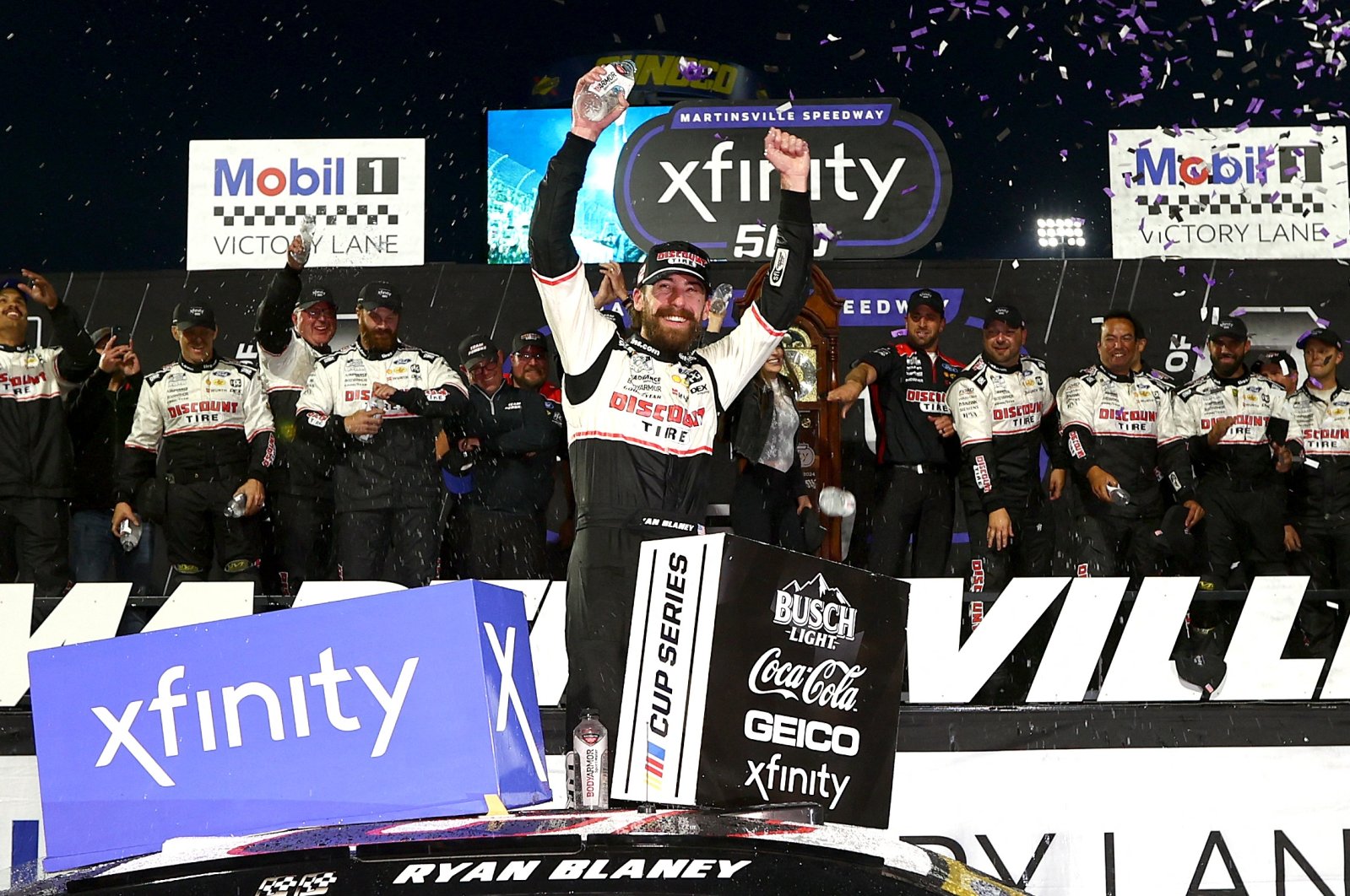 Ryan Blaney, driver of the #12 Discount Tire Ford, celebrates in victory lane after winning the NASCAR Cup Series Xfinity 500 at Martinsville Speedway, Martinsville, Virginia, U.S., Nov. 3, 2024. (AFP Photo)