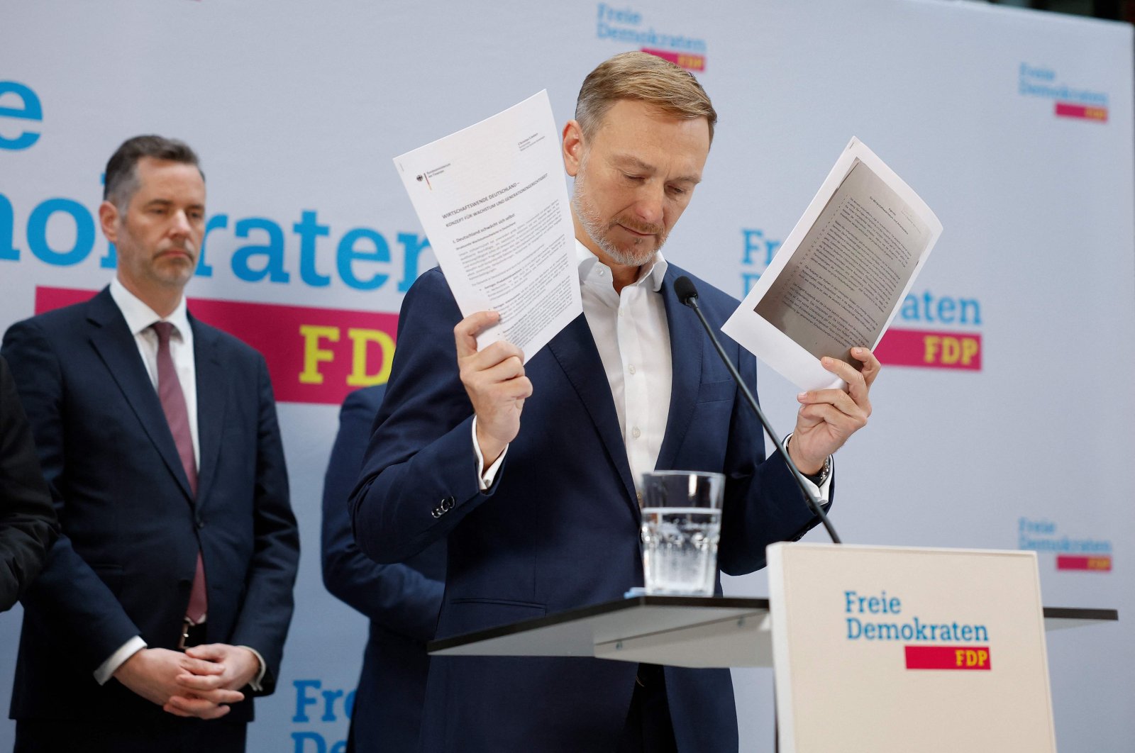 Outgoing German Finance Minister and leader of Germany&#039;s Free Democratic Party (FDP) Christian Lindner shows concept papers on growth as he addresses a news conference at his party&#039;s headquarters, Berlin, Germany, Nov. 7, 2024. (AFP Photo)