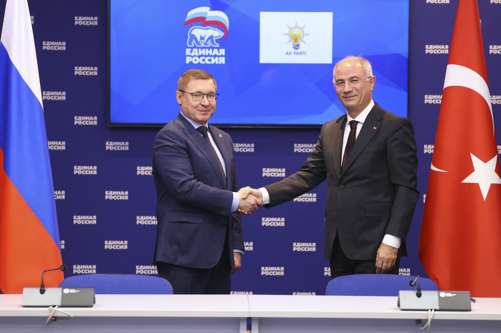 AK Party Deputy Chair Efkan Ala (R) shakes hands with Vladimir Yakushev, first deputy speaker of the Federation Council (L), Moscow, Russia, Nov. 7, 2024. (AA Photo)