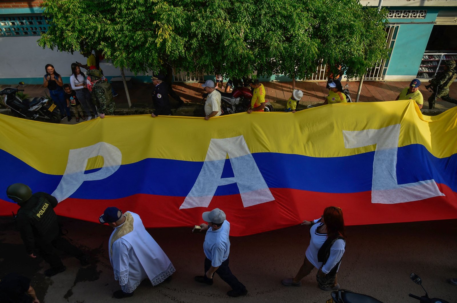 A Colombian flag with the word &quot;PEACE&quot; is seen during the military parade to commemorate Colombia&#039;s Independence Day in Tibu, North Santander Department, Colombia, July 20, 2024. (AFP File Photo)