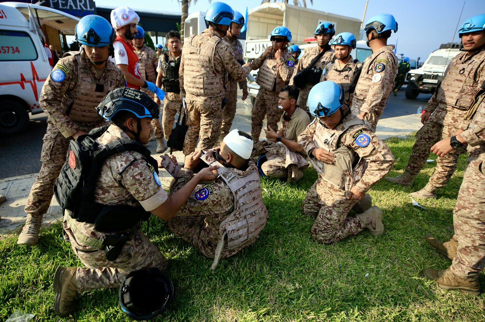 An injured member of the Malaysian UNIFIL peacekeeping force receives medical treatment at the site of an Israeli strike on a vehicle, at the entrance of the southern city of Sidon, Lebanon, Nov. 7, 2024. (EPA Photo)