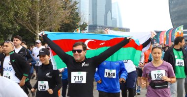 People are seen during the "Victory Run" celebrating the Karabakh Victory, Baku, Azerbaijan, Nov. 8, 2024 (AA Photo)