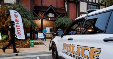 Police provide security as voters wait to cast their ballots at the Dekalb County Avondale Estates City Hall voting precinct as the polls open on Election Day in Avondale Estates, Georgia, Nov. 5, 2024. (EPA Photo)