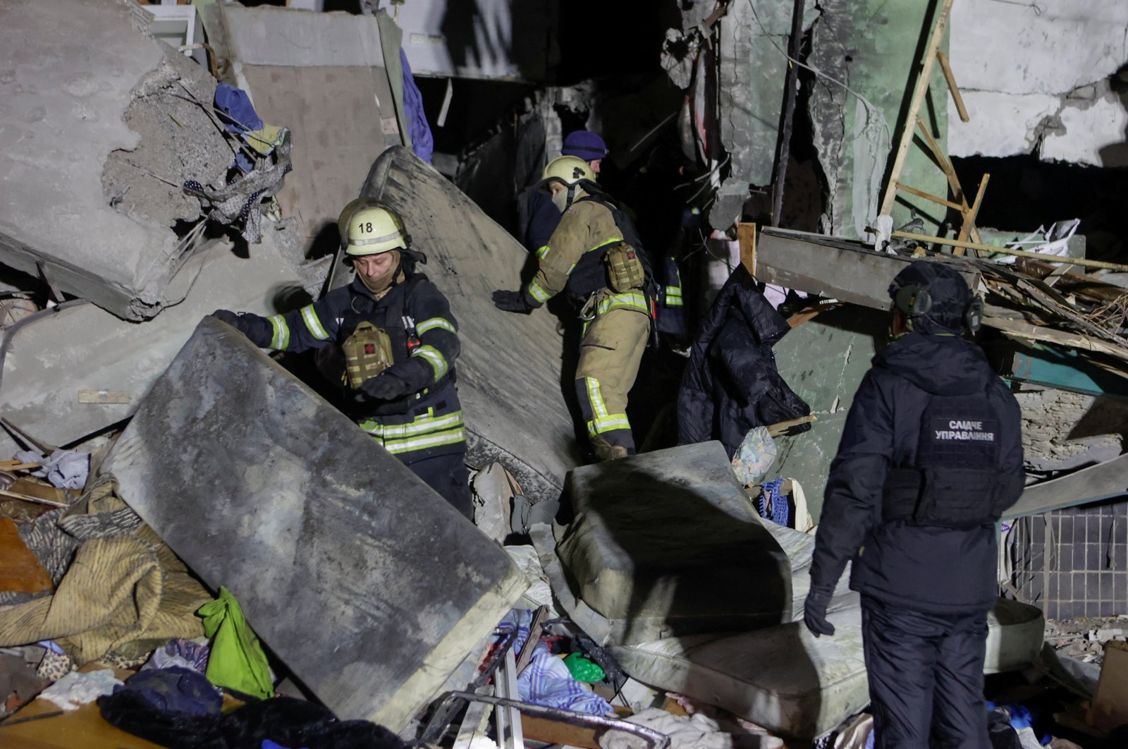 Rescuers work at a site of an apartment building hit by a Russian airstrike, Kharkiv, Ukraine, Nov. 8, 2024. (Reuters Photo)