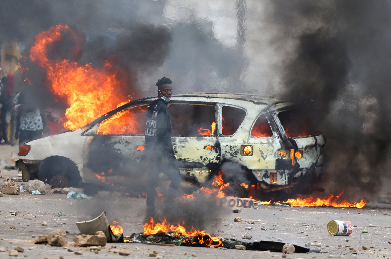 A protester looks on near a burning barricade during a "national shutdown" against the election outcome, Maputo, Mozambique, Nov. 7, 2024. (Reuters Photo)