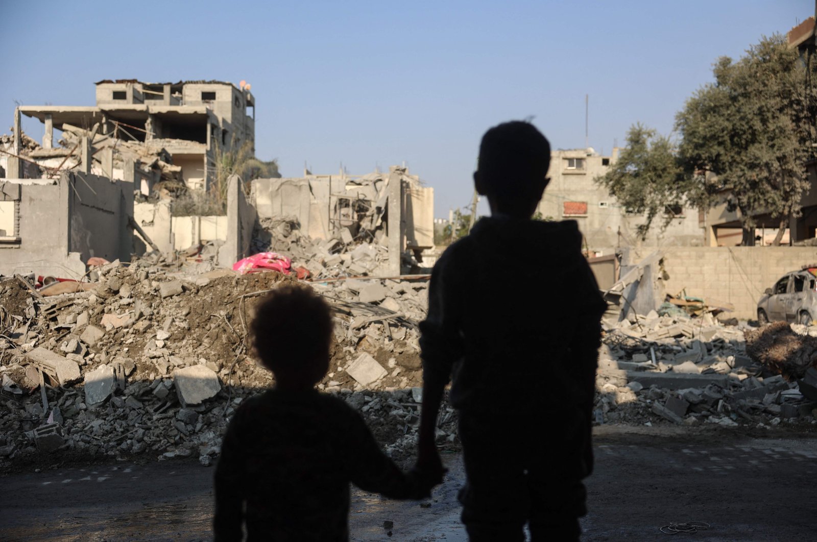 Children stare at the destruction following an Israeli strike in the Nuseirat refugee camp in the central Gaza Strip, Nov. 7, 2024. (AFP Photo)