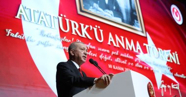 President Recep Tayyip Erdoğan speaks in front of a photo of Atatürk at an event in the capital Ankara, Türkiye, Nov. 10, 2024. (İHA Photo) 