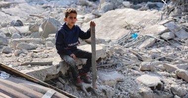 A Palestinian boy sits amid the destruction following an Israeli strike in Jabalia in the northern Gaza Strip, Palestine, Nov. 10, 2024. (AFP Photo)