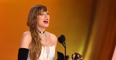U.S. singer-songwriter Taylor Swift accepts the Best Pop Vocal Album award for &quot;Midnights&quot; on stage during the 66th Annual Grammy Awards at the Crypto.com Arena in Los Angeles, U.S., Feb. 4, 2024. (AFP Photo)