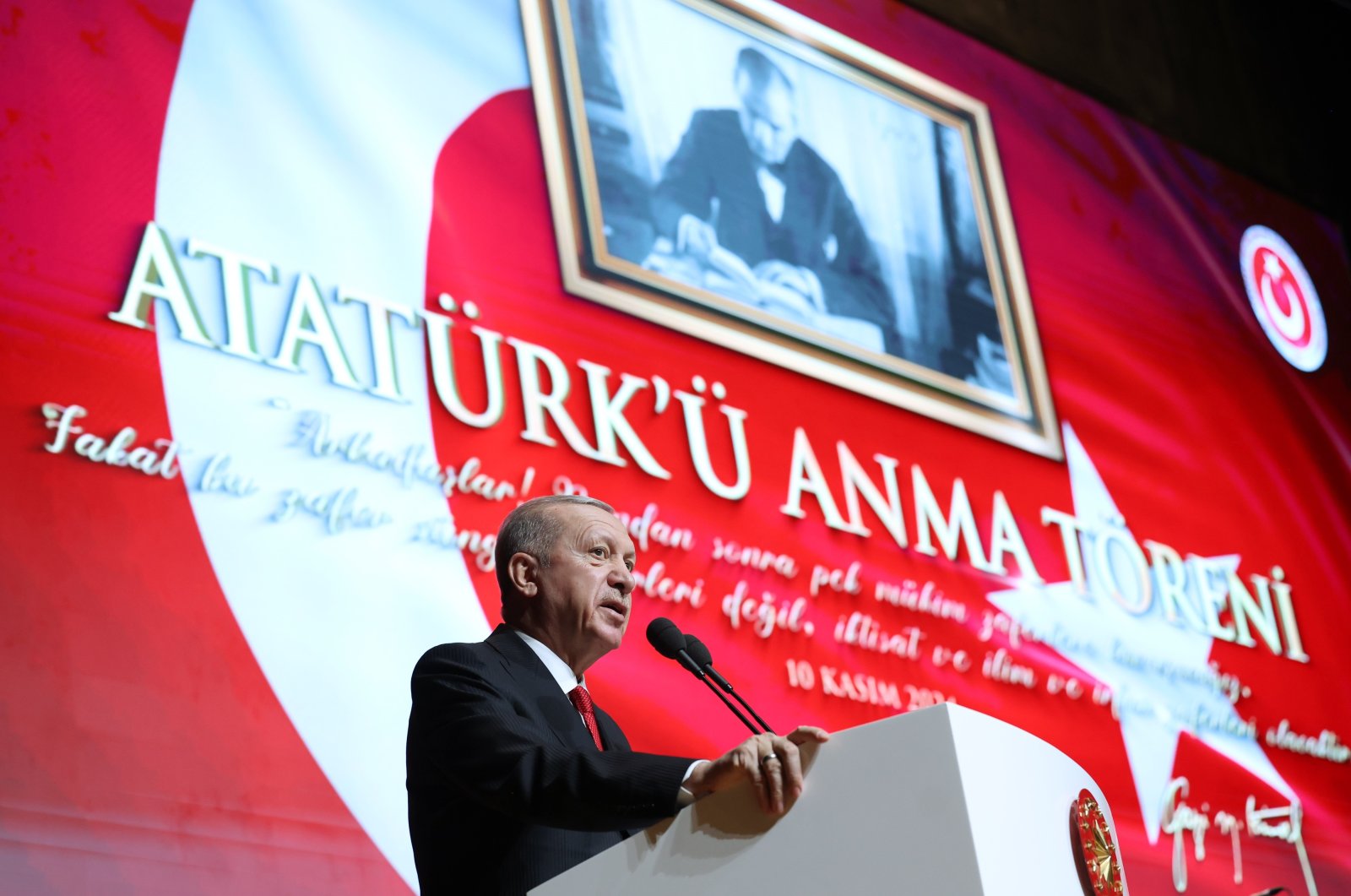 President Recep Tayyip Erdoğan speaks in front of a photo of Atatürk at an event in the capital Ankara, Türkiye, Nov. 10, 2024. (İHA Photo) 