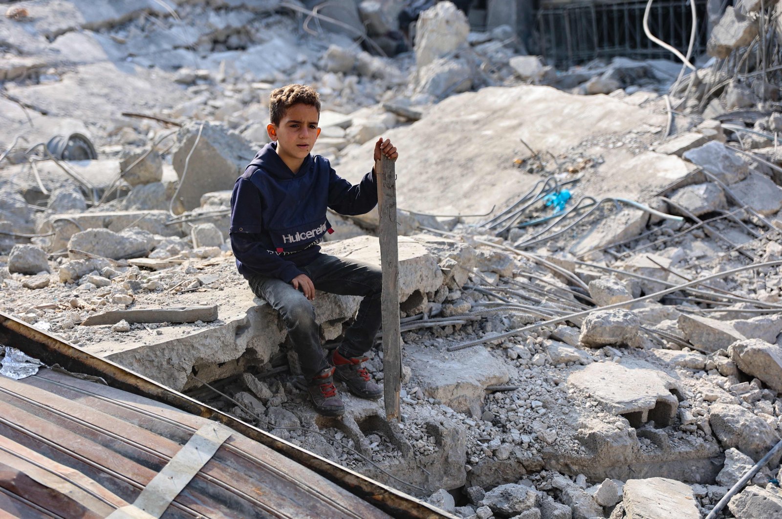 A Palestinian boy sits amid the destruction following an Israeli strike in Jabalia in the northern Gaza Strip, Palestine, Nov. 10, 2024. (AFP Photo)