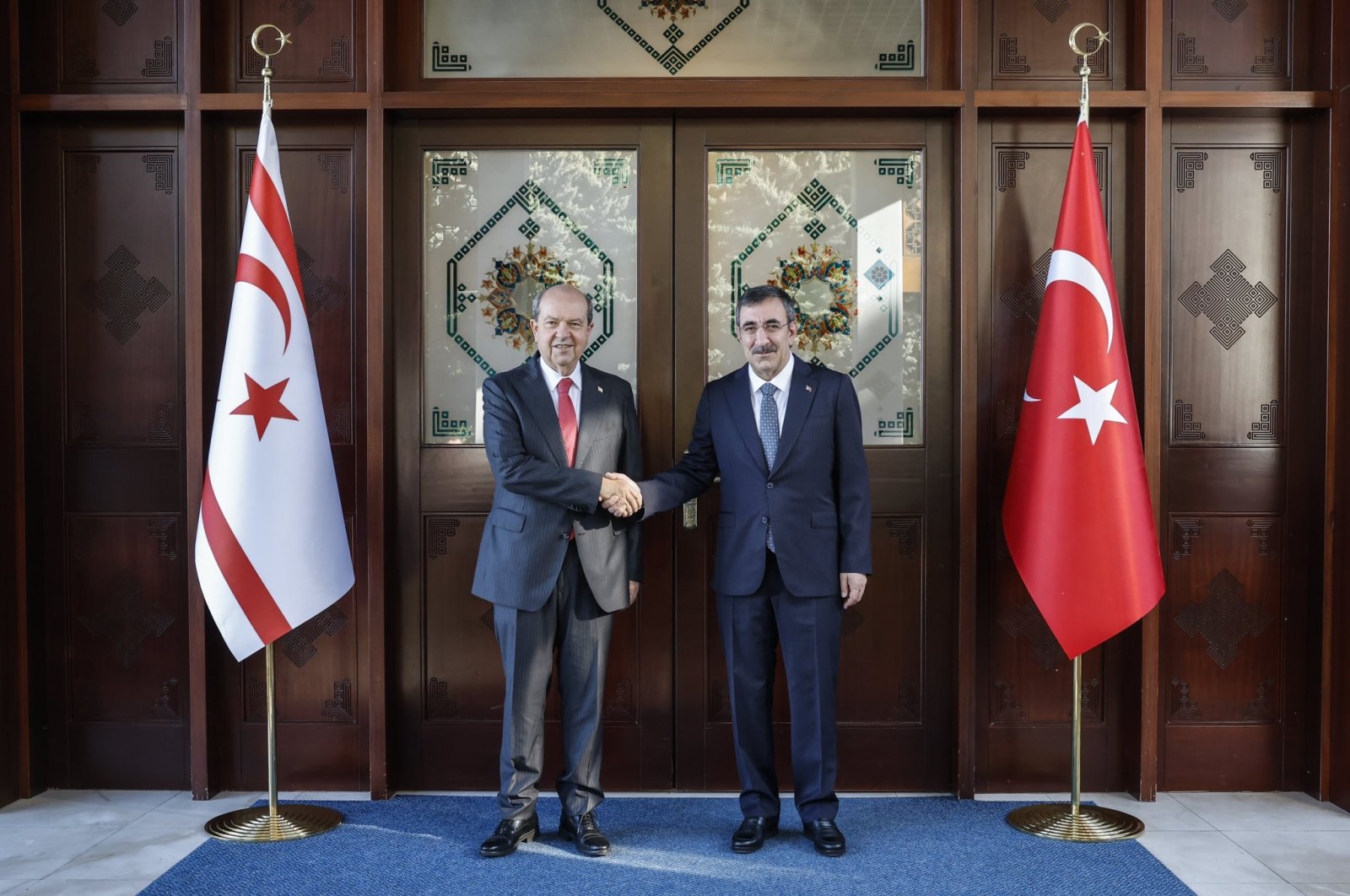 TRNC President Ersin Tatar (L) shakes hands with Vice President Cevdet Yılmaz in the capital Ankara, Türkiye, Nov. 9, 2024. (DHA Photo)