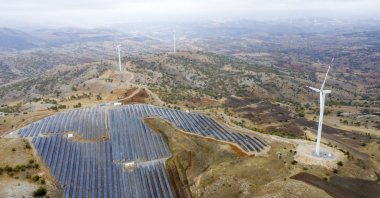 Aerial view of wind turbines and a solar panel farm in Kayseri, Türkiye, Nov. 17, 2020. (Getty Images Photo)