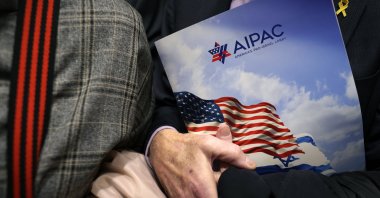 A visitor holds an AIPAC folder on Capitol Hill in Washington, D.C., U.S., March 12, 2024. (Getty Images)