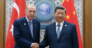 President Recep Tayyip Erdoğan (L) shakes hands with Chinese President Xi Jinping during their meeting, Astana, Kazakhstan, July 4, 2024. (AA Photo)