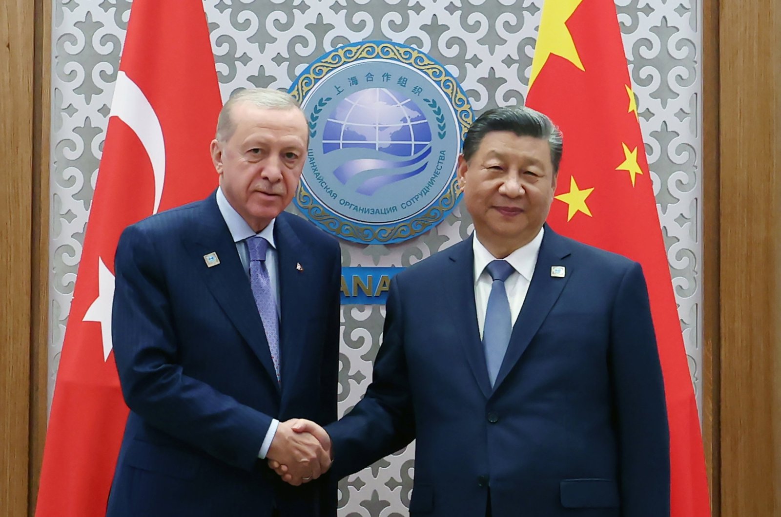 President Recep Tayyip Erdoğan (L) shakes hands with Chinese President Xi Jinping during their meeting, Astana, Kazakhstan, July 4, 2024. (AA Photo)