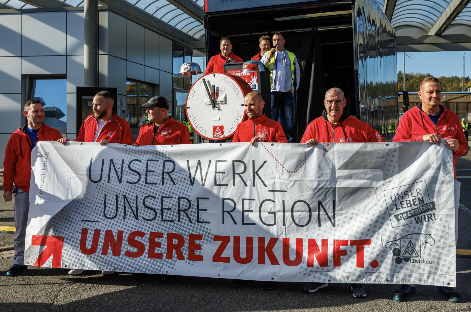 Employees of the Volkswagen plant in Zwickau demonstrate with a banner reading "Our plant, our region, ou future" on the factory premises during an information event organised by the Works Council of Volkswagen Saxony in Zwickau, Germany, Oct. 28, 2024. (AFP Photo)