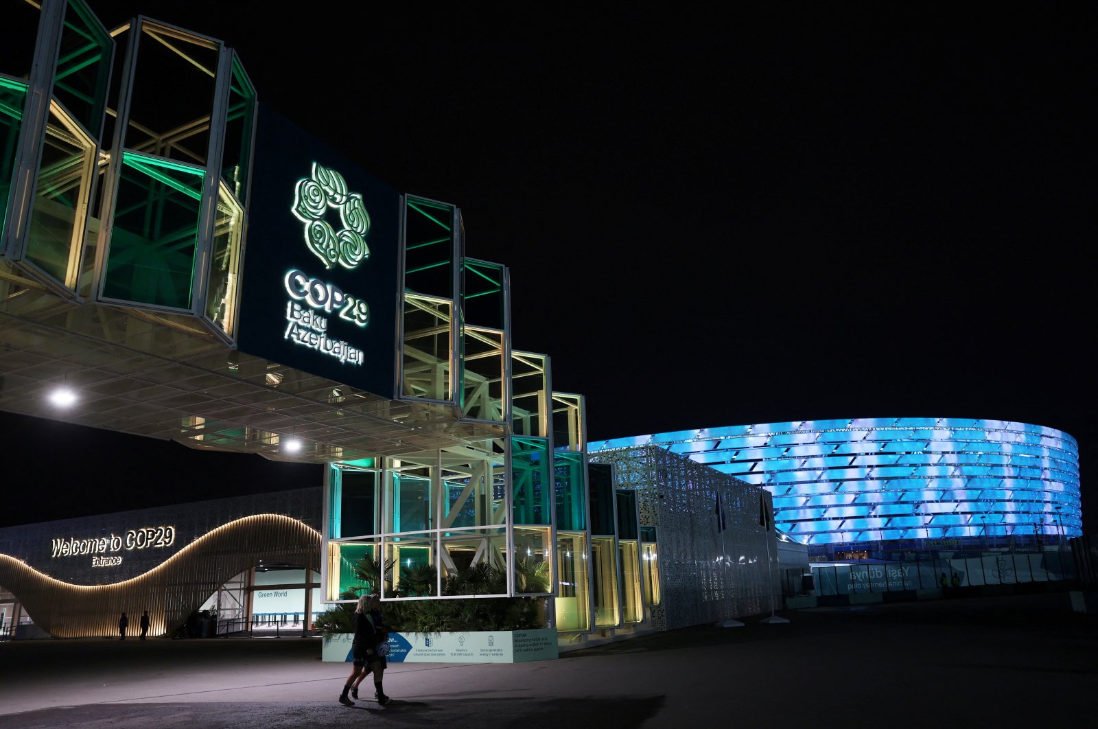 People leave the venue during the United Nations climate change conference, known as COP29, in Baku, Azerbaijan, Nov. 11, 2024. (Reuters Photo)