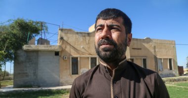 Uways Bathavi, who was detained for five years by PKK/YPG terrorists, speaks during an interview in the northern region of Tal Abyad, Syria, June 27, 2024. (AA Photo)