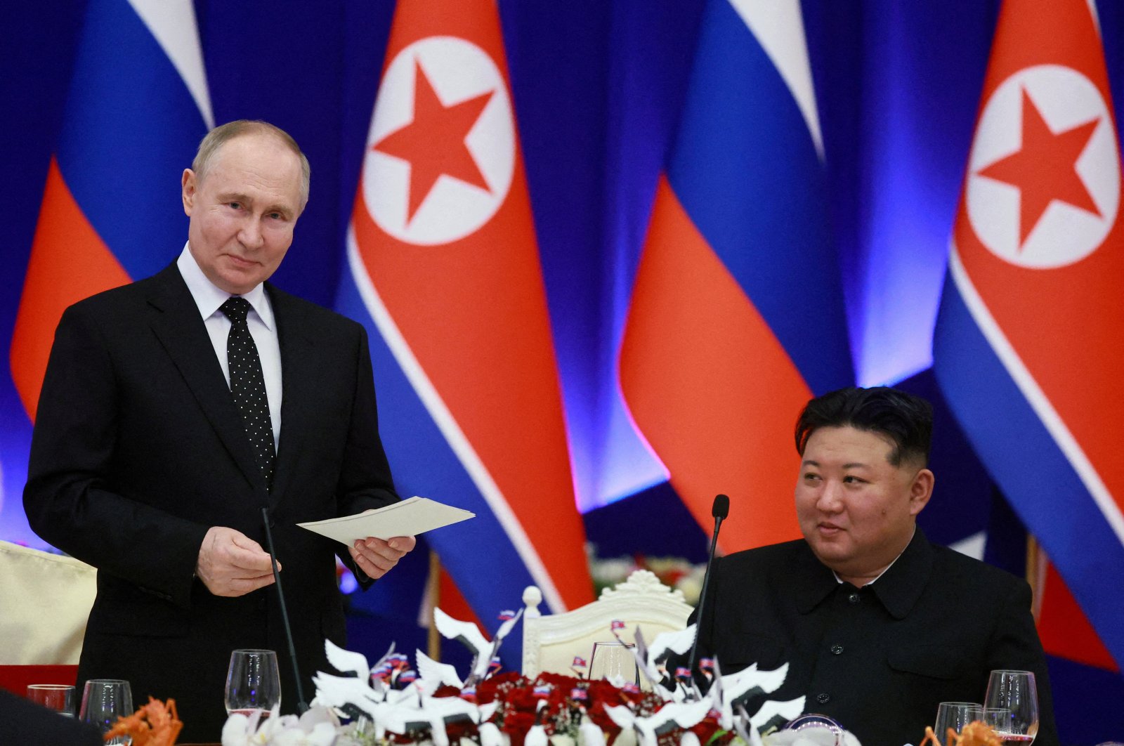 Russian President Vladimir Putin (L) and North Korea&#039;s leader Kim Jong Un attend a state reception in Pyongyang, North Korea, June 19, 2024. (Reuters Photo)