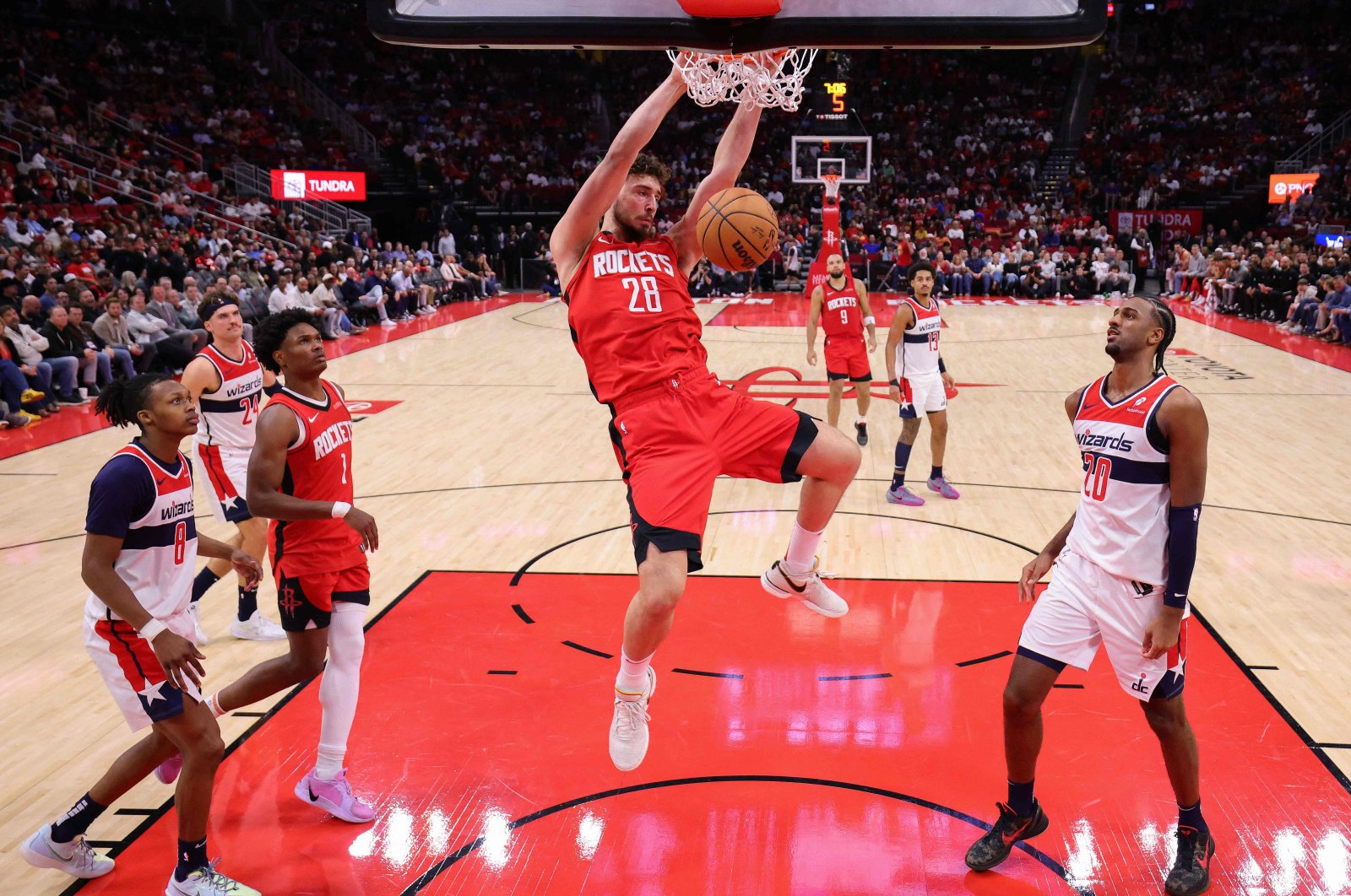 Alperen Şengün of the Houston Rockets dunks the ball over Alexandre Sarr of the Washington Wizards during the second half at Toyota Center, in Houston, Texas, U.S., Nov. 11, 2024. (AFP Photo)