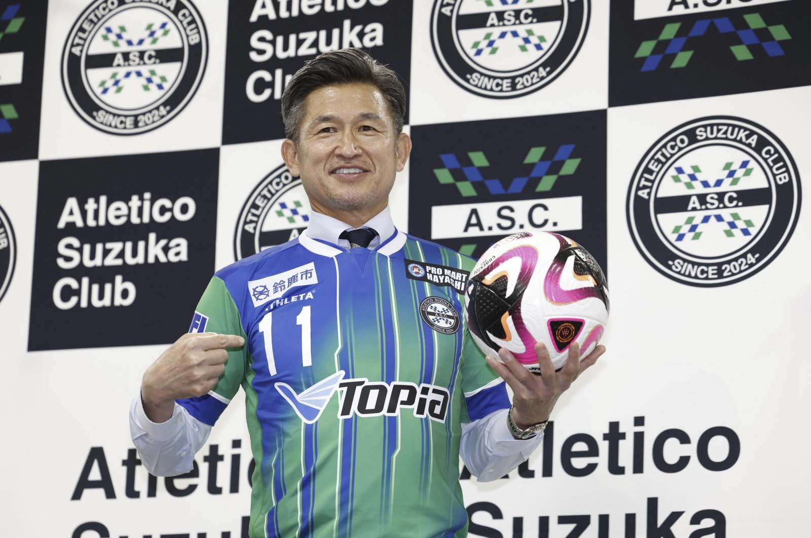 Kazuyoshi Miura poses at a news conference at National Stadium, Tokyo, Japan, June 25, 2024. (AP Photo)