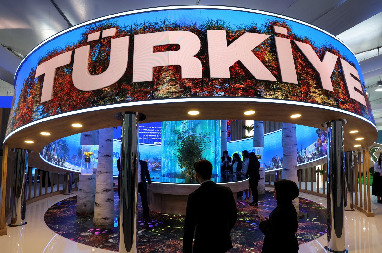 People walk near Türkiye&#039;s pavilion in the Green Zone at the COP29 United Nations Climate Change Conference in Baku, Azerbaijan. Nov. 11, 2024. (Reuters Photo) 