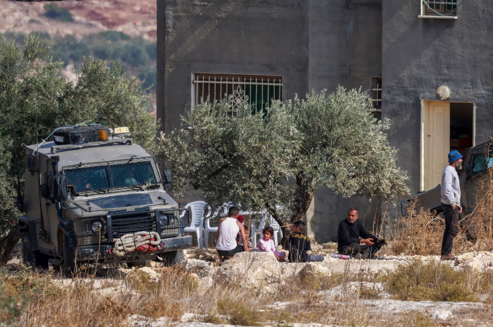 Israeli soldiers detain a family outside a house where a Palestinian man was reportedly killed during a raid in the Tubas area in the occupied West Bank, Palestine, Nov. 9, 2024. (AFP Photo)