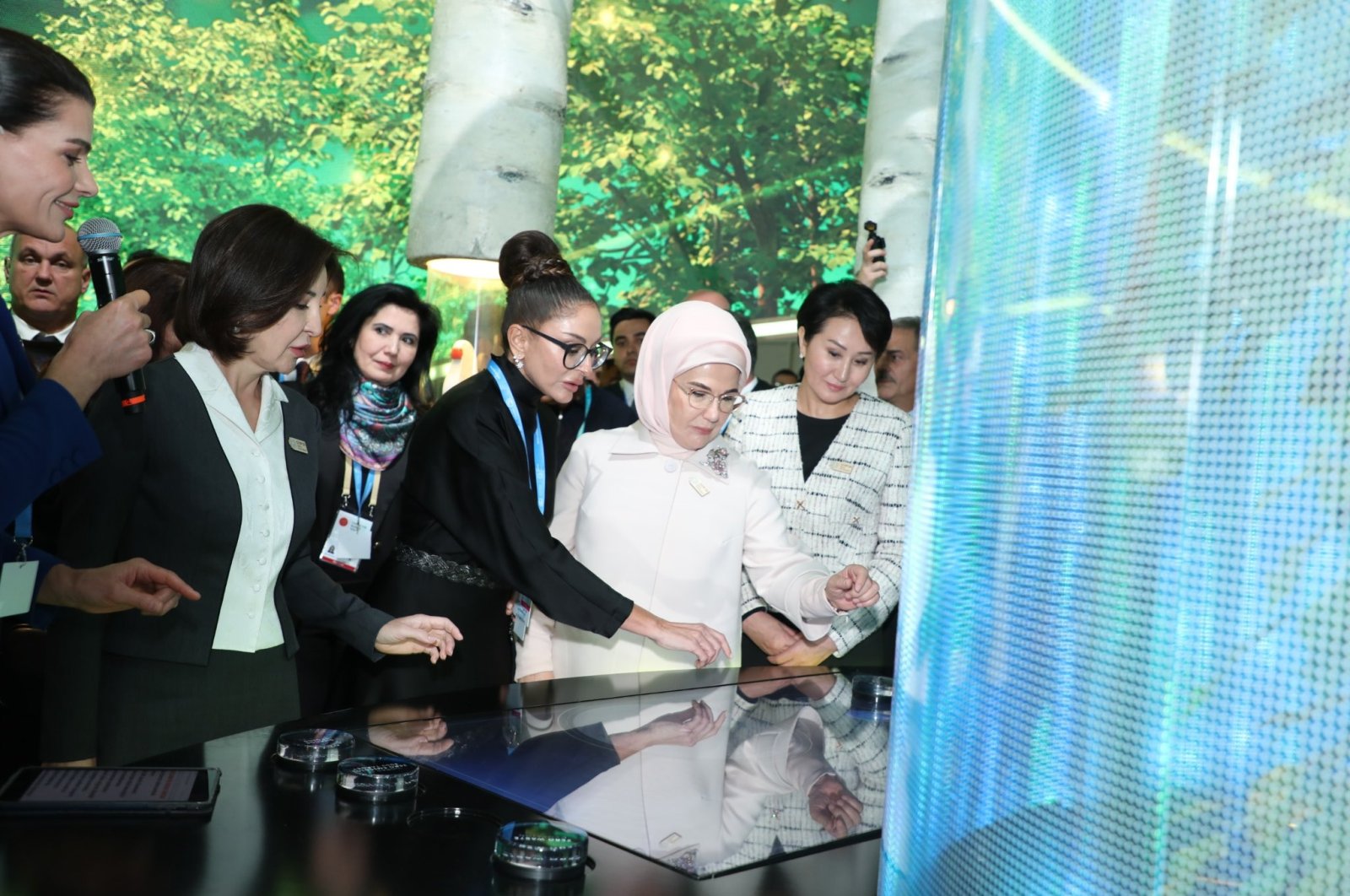 Türkiye&#039;s First Lady Emine Erdoğan (2nd R) and Mehriban Aliyeva (C) at the joint pavilion of the Zero Waste Foundation and the Haydar Aliyev Foundation, Baku, Azerbaijan, Nov. 12, 2024. (DHA Photo)