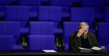 Alexander Gauland, honorary chairperson of the far-right Alternative for Germany (AfD) party, reads as he waits for the swearing-in of the new finance minister at the Bundestag, Germany's lower house of parliament, Berlin, Germany, Nov. 7, 2024.  (AFP Photo)
