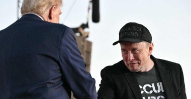 Tesla CEO Elon Musk (R) joins former U.S. President and Republican presidential candidate Donald Trump during a campaign rally at the site of his first assassination attempt in Butler, Pennsylvania, U.S., Oct. 5, 2024. (AFP Photo)