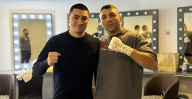 Turkish Education Federation (TEF) President and MES Companies Group Chair Mert Şener poses for a photo with Türkiye&#039;s star boxer Avni Yıldırım, Dubai, UAE, Nov. 12, 2024. (DHA Photo)