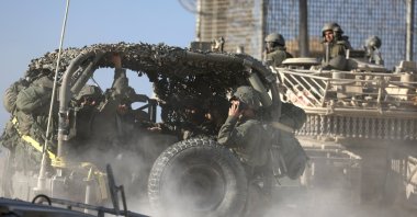 Israeli soldiers ride vehicles while patrolling the border gate during the passing of a World Food Programme (WFP) aid convoy through the Erez crossing, Gaza Strip, Palestine, Nov. 11, 2024. (EPA Photo)
