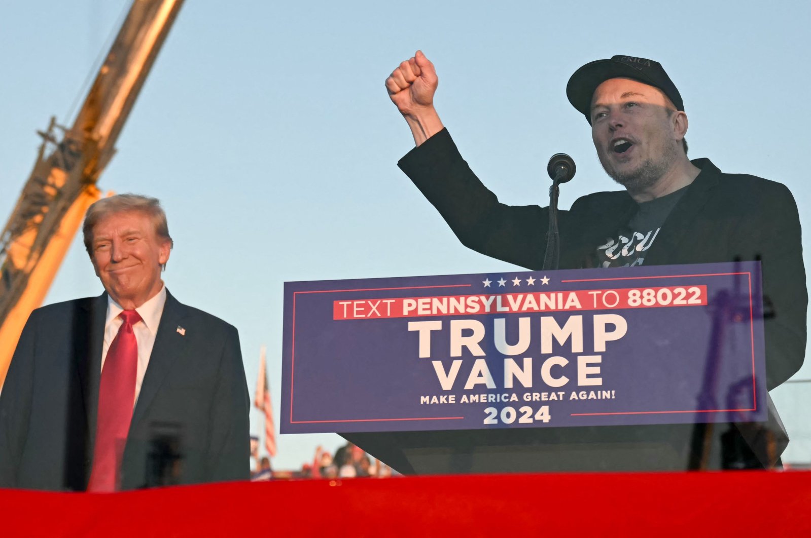 Tesla CEO Elon Musk (R) speaks on stage as he joins former U.S. President and Republican presidential candidate Donald Trump during a campaign rally at the site of the first assassination attempt in Butler, Pennsylvania, U.S., Oct. 5, 2024. (AFP Photo)