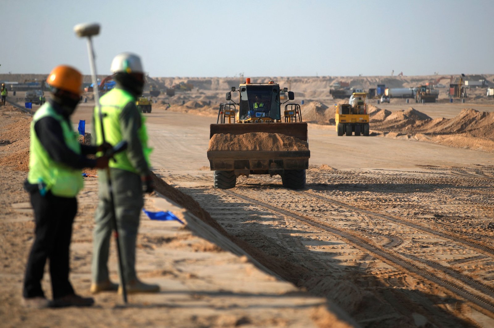 Port workers from Korea&#039;s Daewoo Corporation are seen on the construction site of the Grand Faw Port docks in Basra, southern Iraq, Nov. 6, 2024. (AFP Photo)