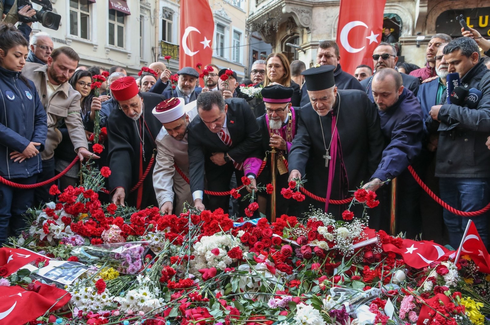 People leave flowers in memory of victims at the site of the Istiklal Street attack, Istanbul, Türkiye, Nov. 16, 2022. (AA Photo)