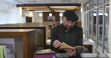 National Intelligence Academy (MIA) Intelligence and Security Research Center Coordinator Serhat Aslaner is seen at a library during an interview with Anadolu Agency (AA), Ankara, Türkiye, Nov. 12, 2024. (AA Photo)