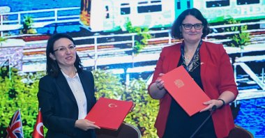 Deputy Ambassador of the U.K. to Türkiye Wendy Wyver (R) and Deputy Director General of European Union and Foreign Affairs of the Ministry of Transport and Infrastructure Ömrüye Ayan pose for a photo after signing a "Memorandum of Understanding on Cooperation in the Railway Sector," Ankara, Türkiye, Nov. 14, 2024. (AA Photo)