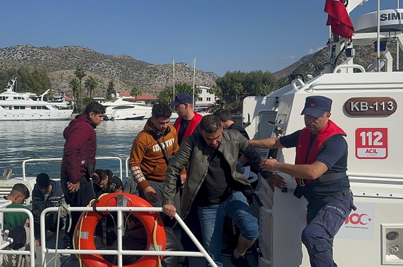 The Turkish coast guard picks up a life raft carrying 27 irregular migrants off the coast of western Muğla province, Türkiye, Nov. 1, 2024. (AA Photo)