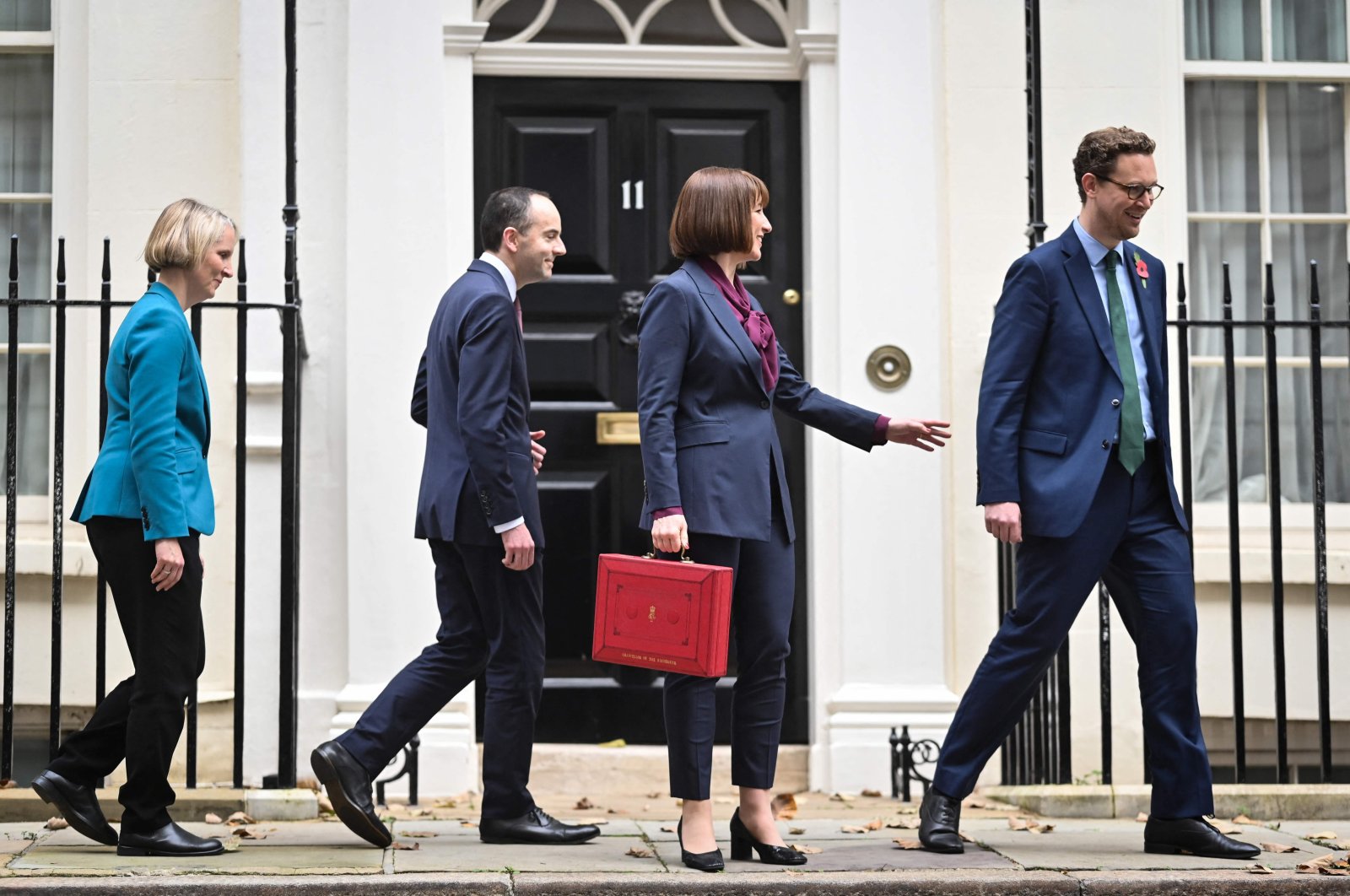 Britain&#039;s Chancellor of the Exchequer Rachel Reeves (C), holding the red Budget Box, gestures to Chief Secretary to the Treasury Darren Jones (R) as they leave with Parliamentary Secretary Emma Reynolds (L) and Exchequer Secretary James Murray from outside of 11 Downing Street, central London, U.K., Oct. 30, 2024. (AFP Photo)