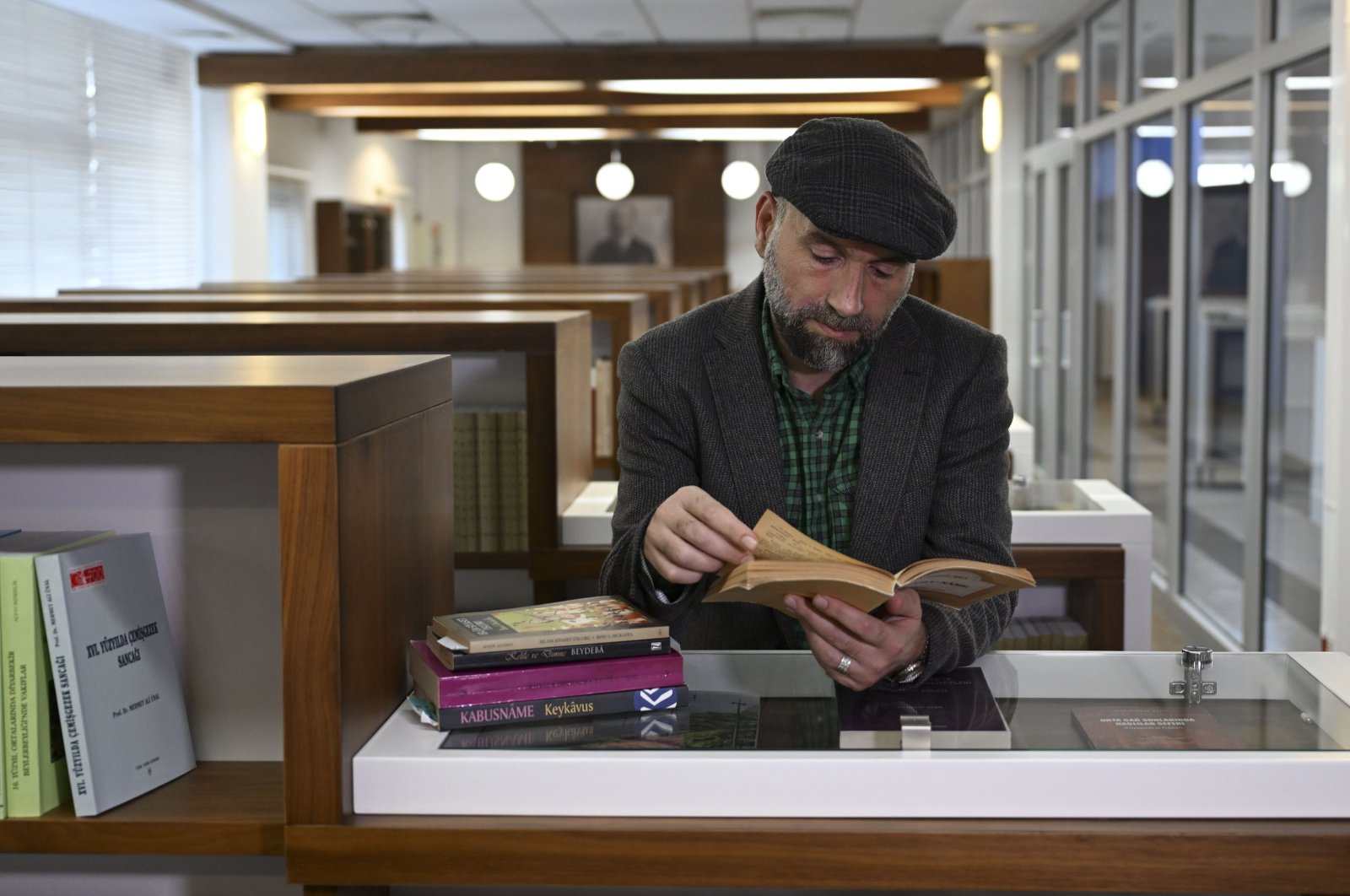 National Intelligence Academy (MIA) Intelligence and Security Research Center Coordinator Serhat Aslaner is seen at a library during an interview with Anadolu Agency (AA), Ankara, Türkiye, Nov. 12, 2024. (AA Photo)