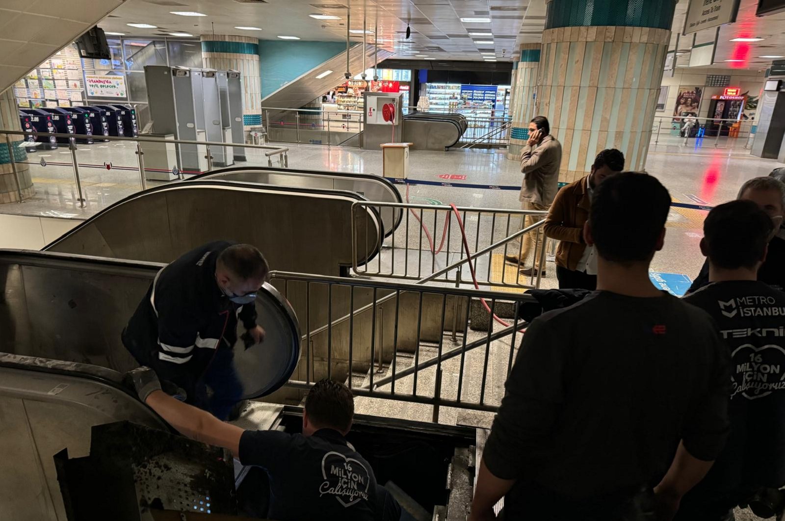 Teams work on the escalator at Yenikapı metro station after the fire, Istanbul, Türkiye, Nov. 14, 2024. (AA Photo) 
