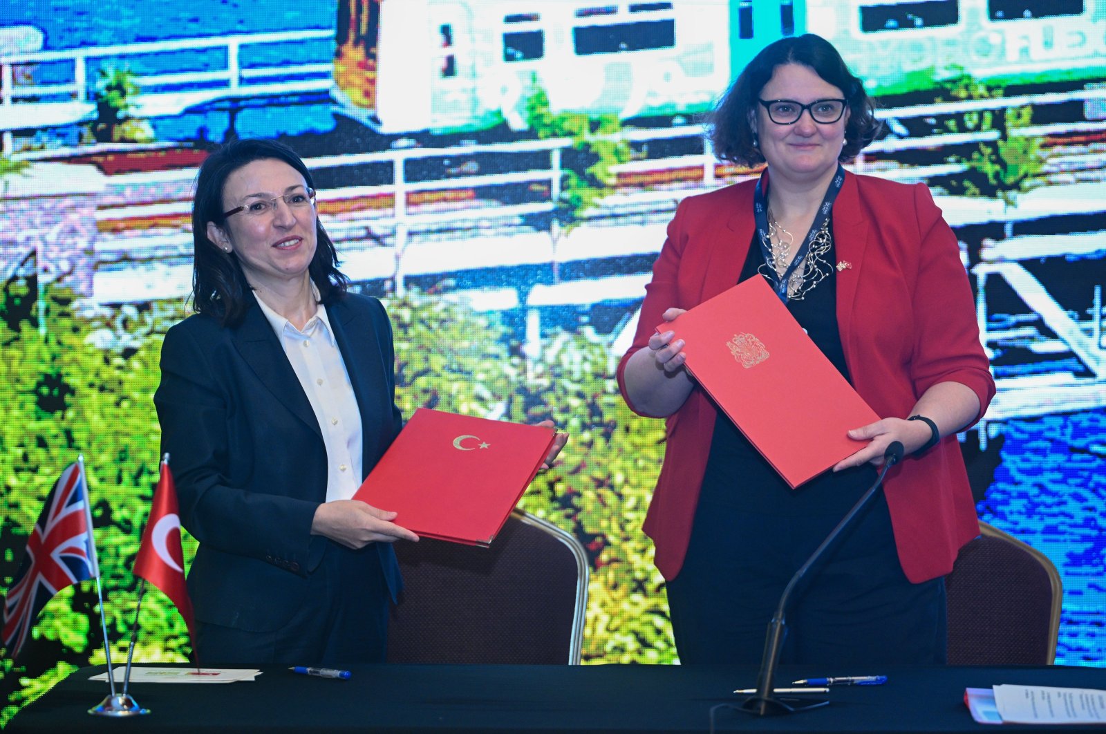 Deputy Ambassador of the U.K. to Türkiye Wendy Wyver (R) and Deputy Director General of European Union and Foreign Affairs of the Ministry of Transport and Infrastructure Ömrüye Ayan pose for a photo after signing a "Memorandum of Understanding on Cooperation in the Railway Sector," Ankara, Türkiye, Nov. 14, 2024. (AA Photo)