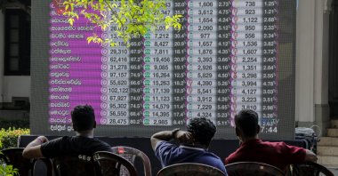 People watch election results displayed on a giant screen at a ballot counting center the day after the parliamentary election, in Colombo, Sri Lanka, Nov. 15, 2024. (EPA Photo)