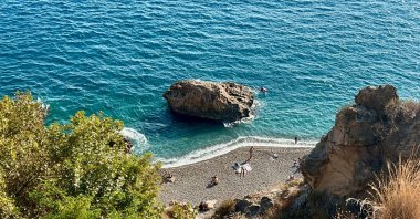 People head to the shores in summer-like weather in early November, Antalya, Türkiye, Nov. 11, 2024. (IHA Photo) 
