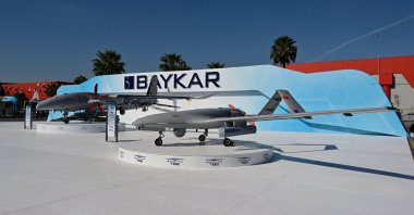 The Bayraktar TB2 drone (R) is on display next to Baykar&#039;s Akıncı unmanned combat aerial vehicle during the SAHA EXPO 2024, an international defense and aerospace exhibition, in Istanbul, Türkiye, Oct. 23, 2024. (AA Photo)